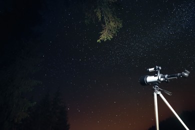 Photo of Modern telescope and beautiful sky in night outdoors. Learning astronomy