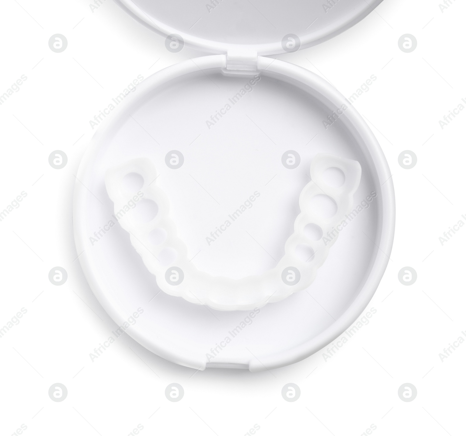 Photo of Dental mouth guard in container on white background, top view. Bite correction