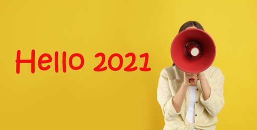 Image of Hello 2021. Woman with megaphone on yellow background