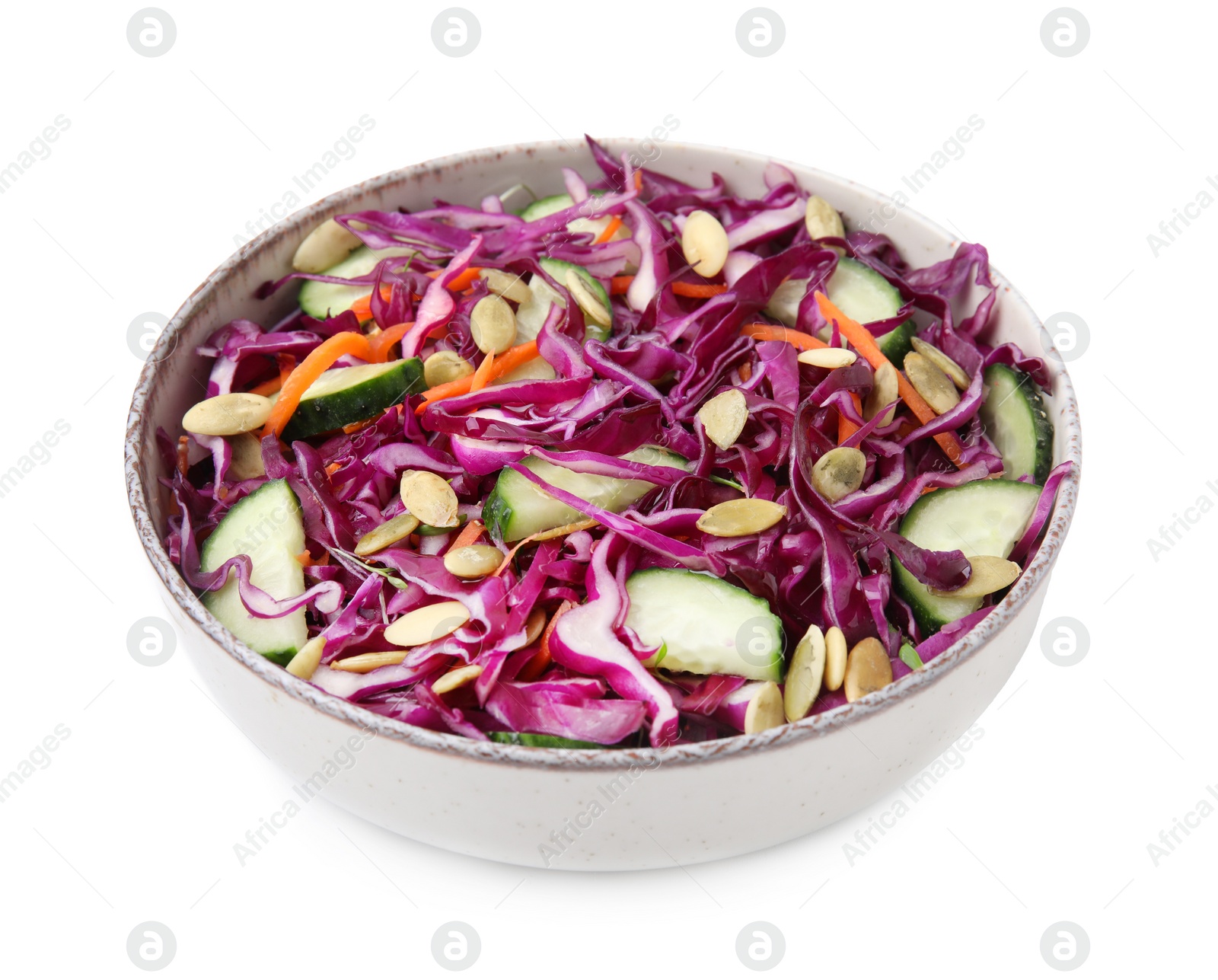 Photo of Tasty salad with red cabbage and pumpkin seeds in bowl isolated on white