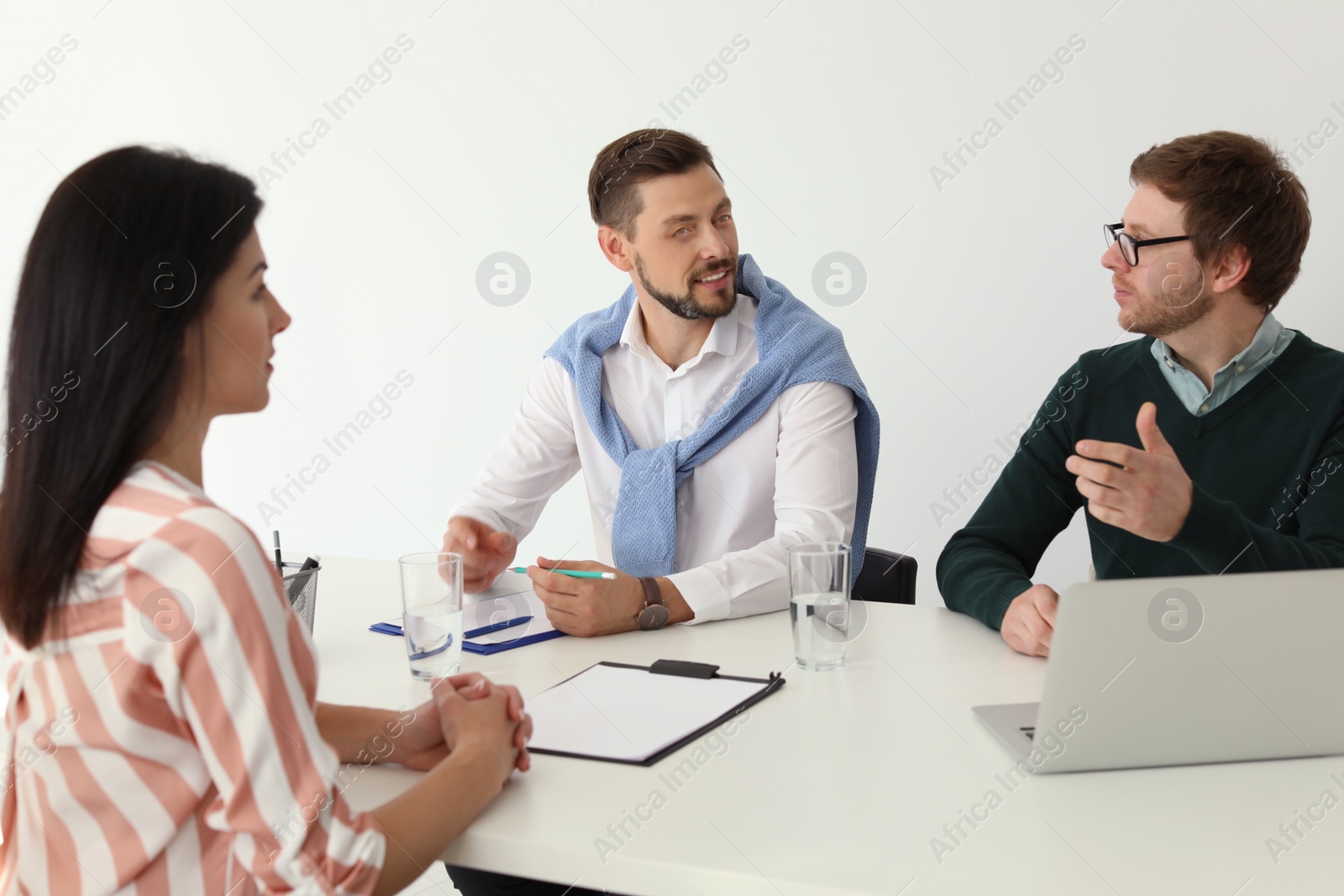 Photo of Human resources commission conducting job interview with applicant in office