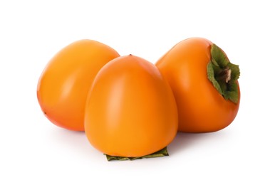 Delicious ripe juicy persimmons on white background