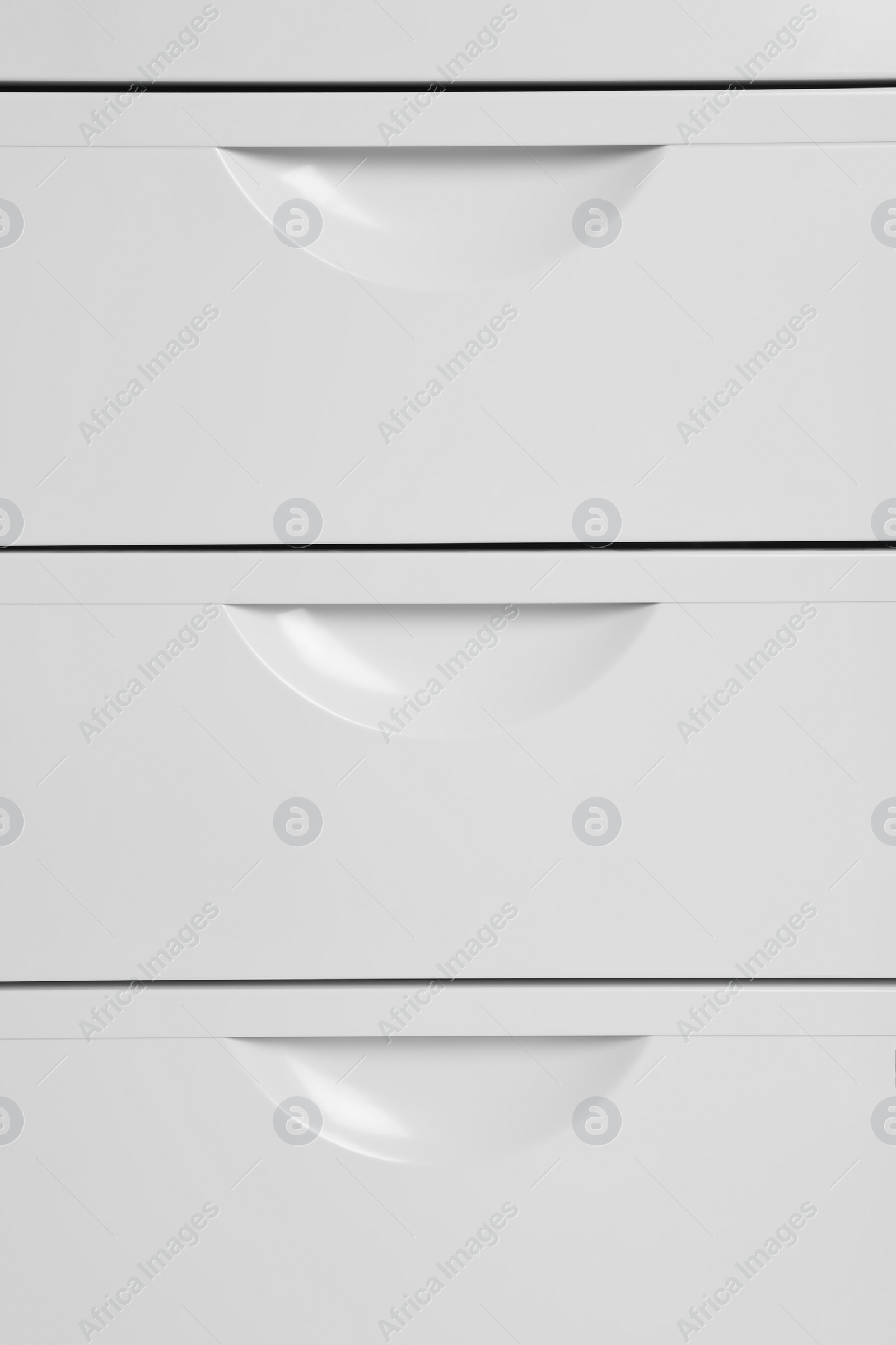 Photo of White wardrobe drawers as background, closeup view