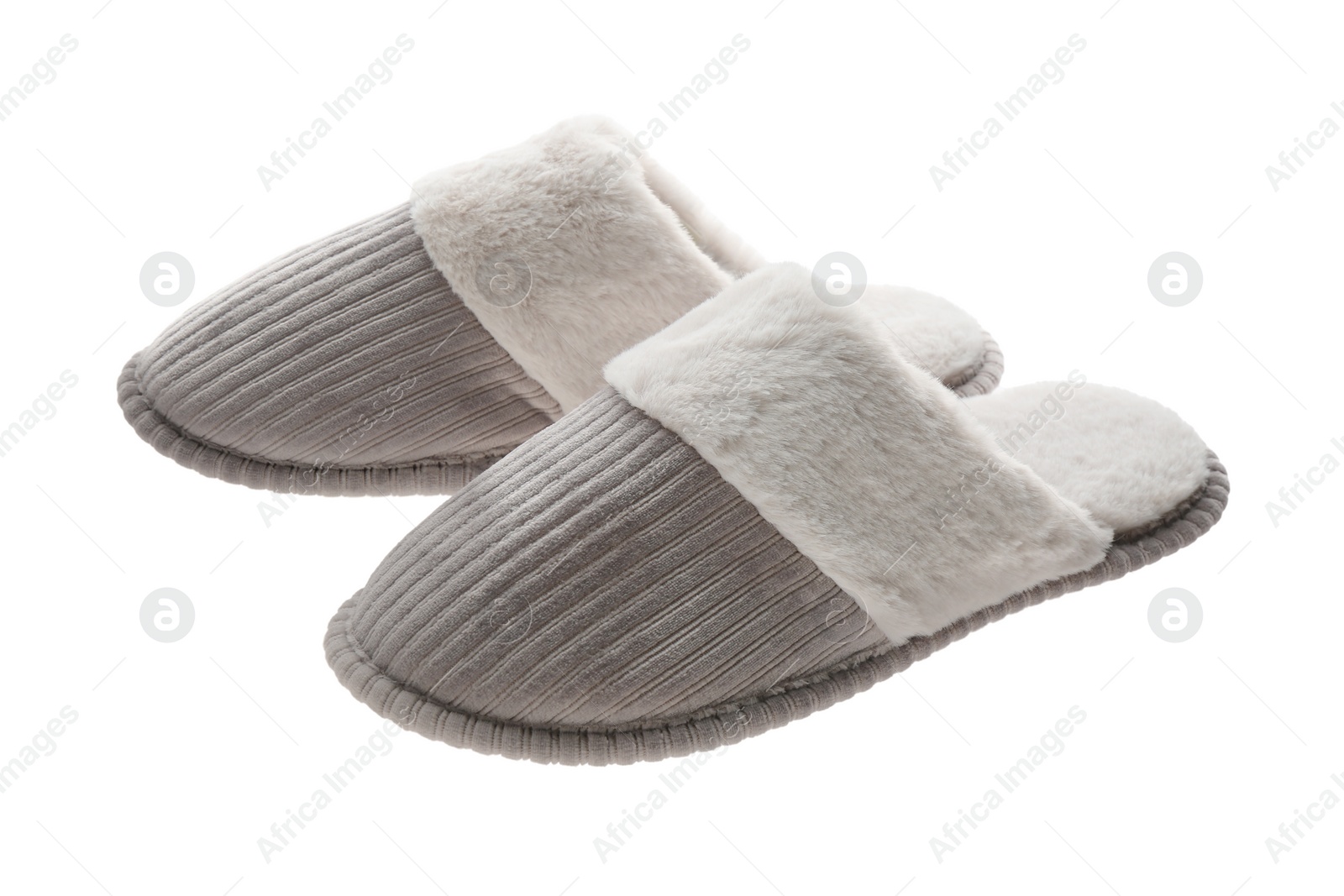 Photo of Pair of soft closed toe slippers on white background