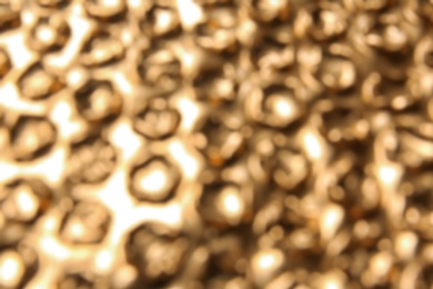 Blurred view of golden bubble wrap as background