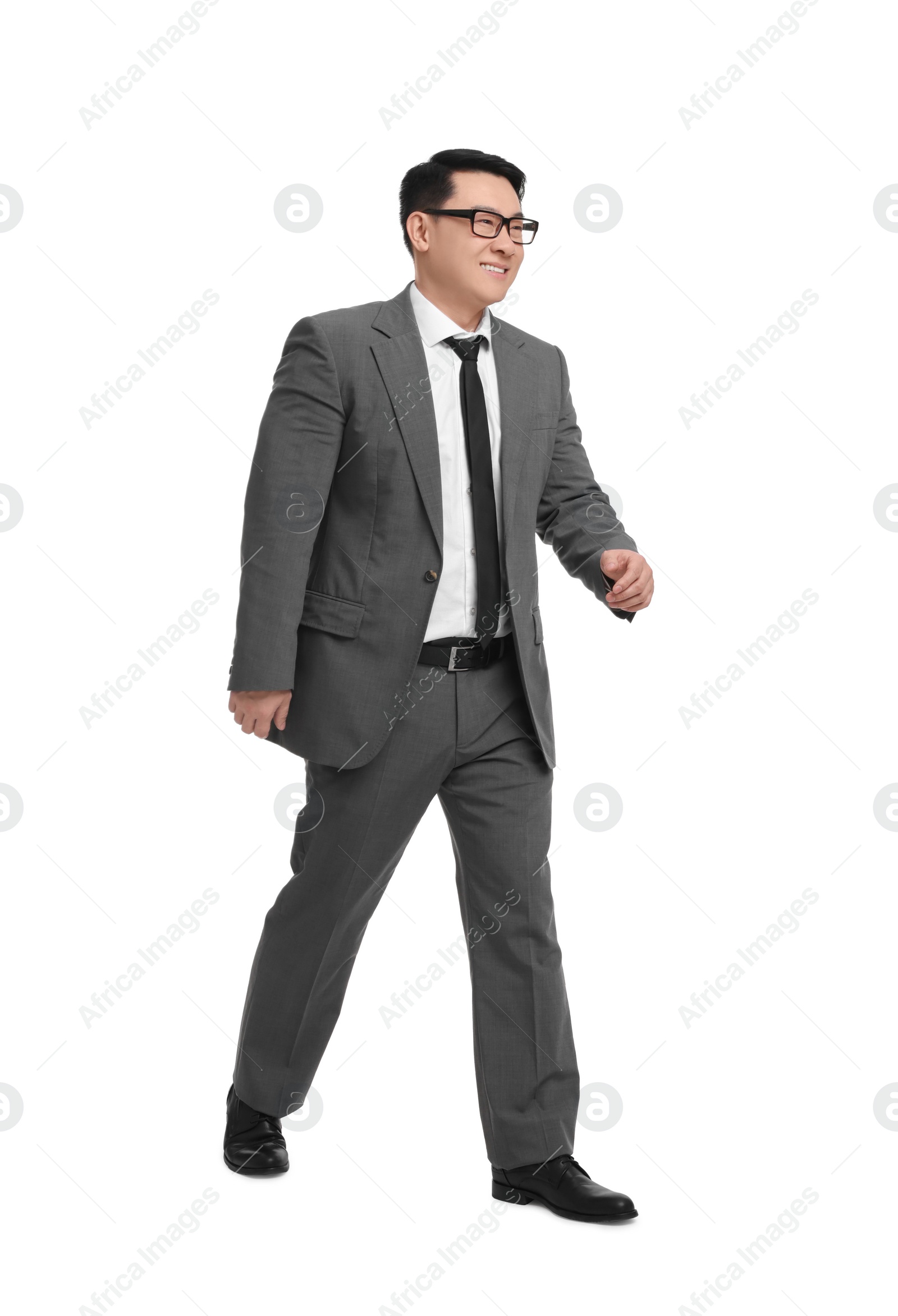 Photo of Businessman in suit walking on white background