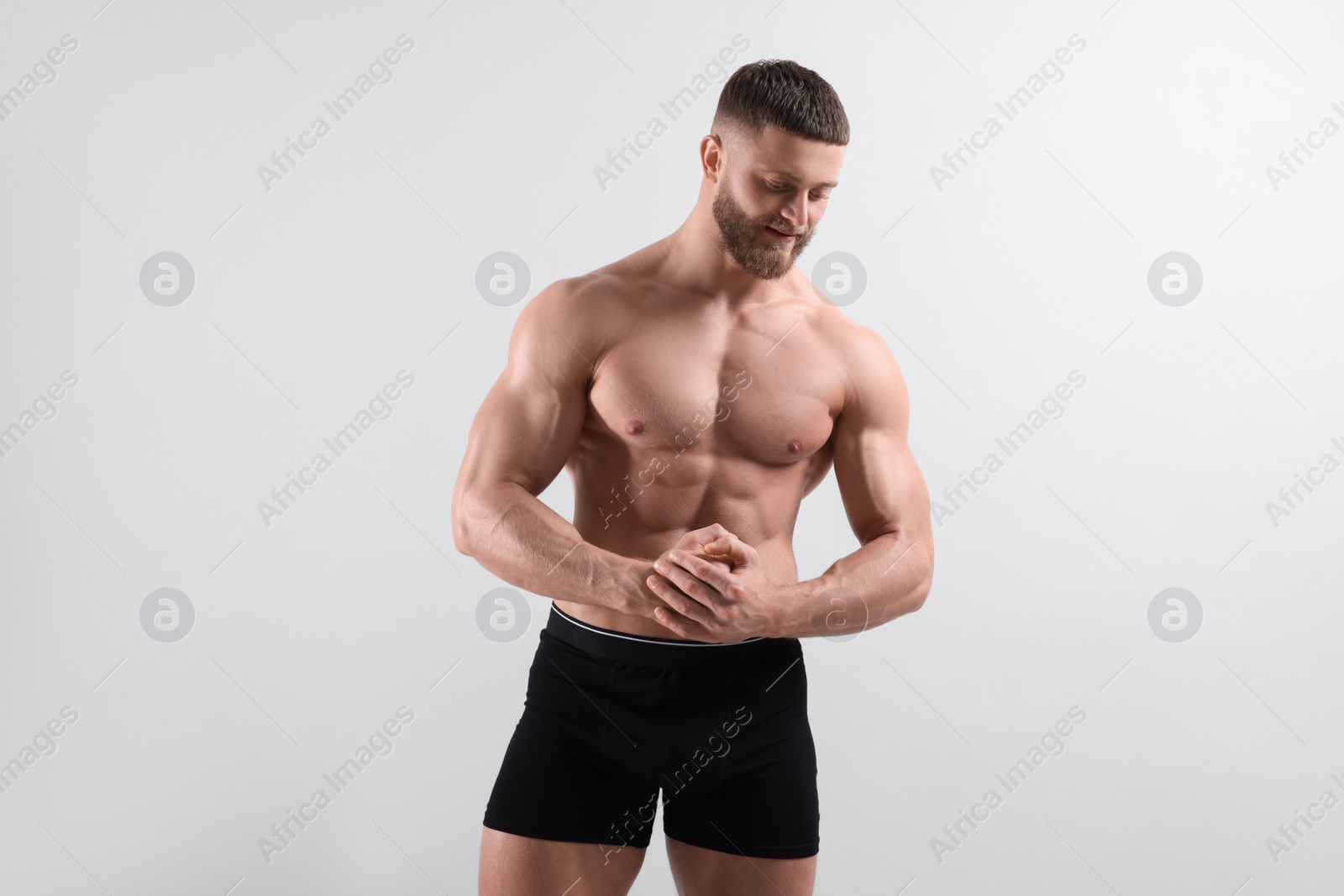 Photo of Young man is stylish black underwear on light grey background