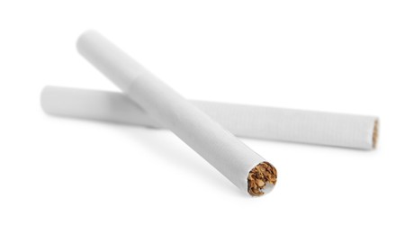 Photo of Cigarettes with filters isolated on white. Bad habit