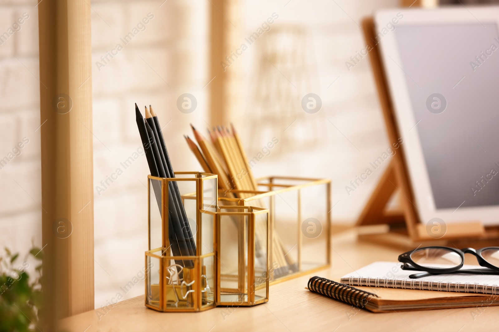 Photo of Gold accessories for interior design on table in room