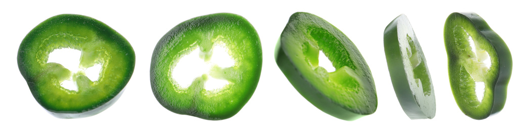 Green hot chili pepper pieces on white background