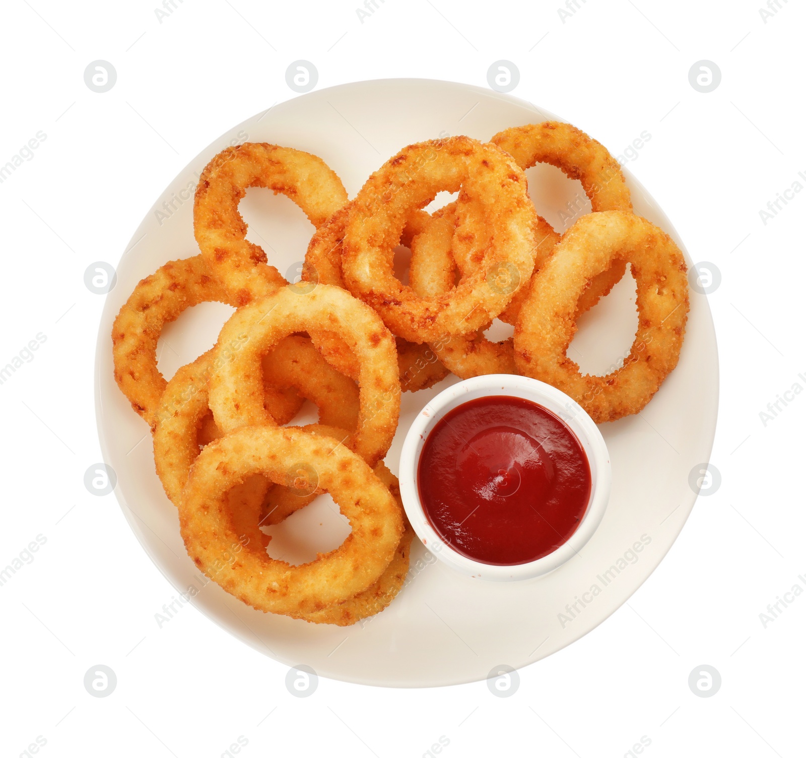 Photo of Plate of tasty fried onion rings with ketchup isolated on white, top view