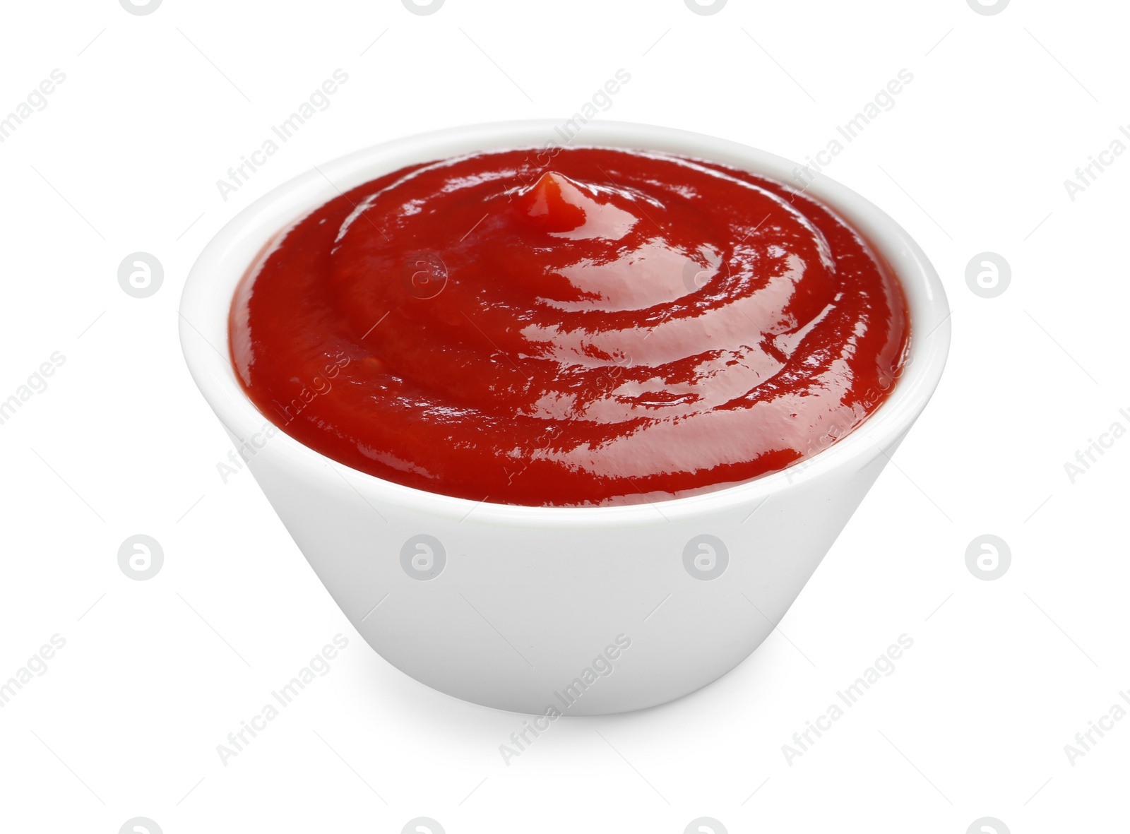 Photo of Tasty ketchup in bowl isolated on white. Tomato sauce