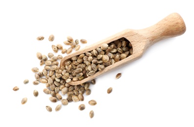 Photo of Wooden scoop with hemp seeds on white background, top view