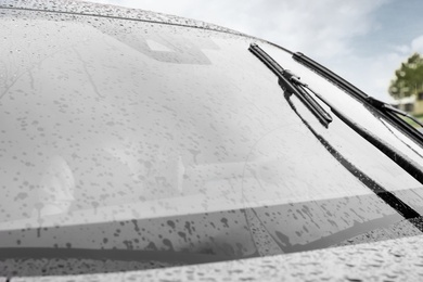 Photo of Closeup view of car window on rainy day, closeup