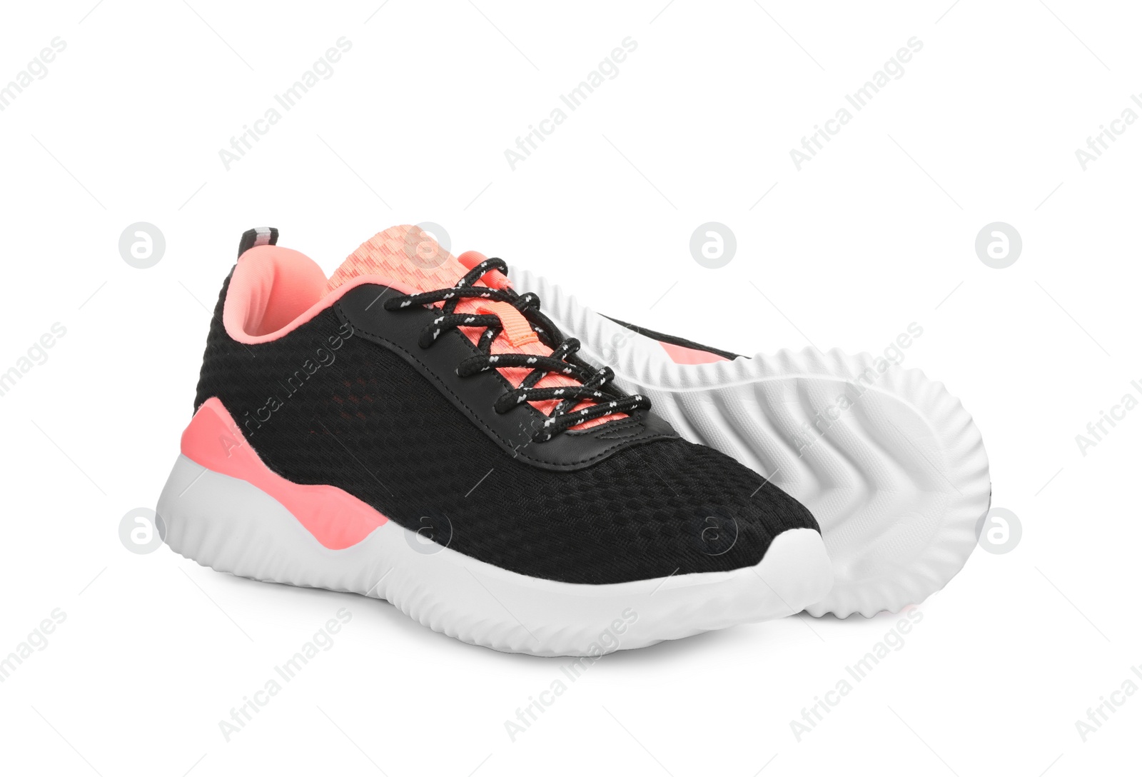 Photo of Pair of comfortable sports shoes on white background