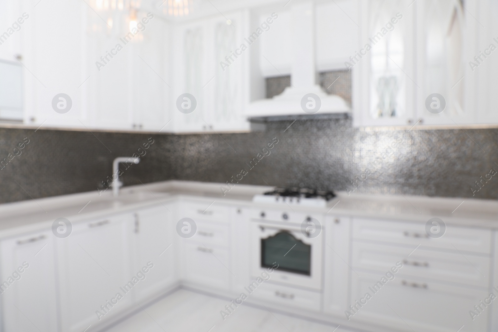 Photo of Blurred view of beautiful kitchen interior with new stylish furniture