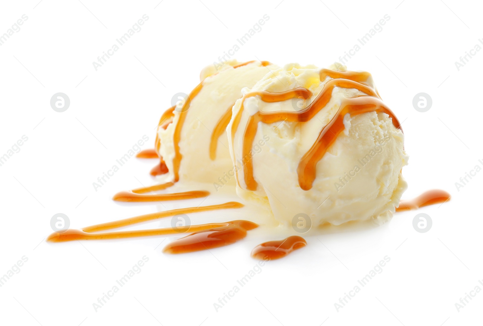 Photo of Balls of tasty vanilla ice cream with caramel topping on white background