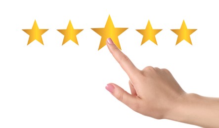 Image of Quality evaluation. Woman touching virtual golden stars on white background, closeup