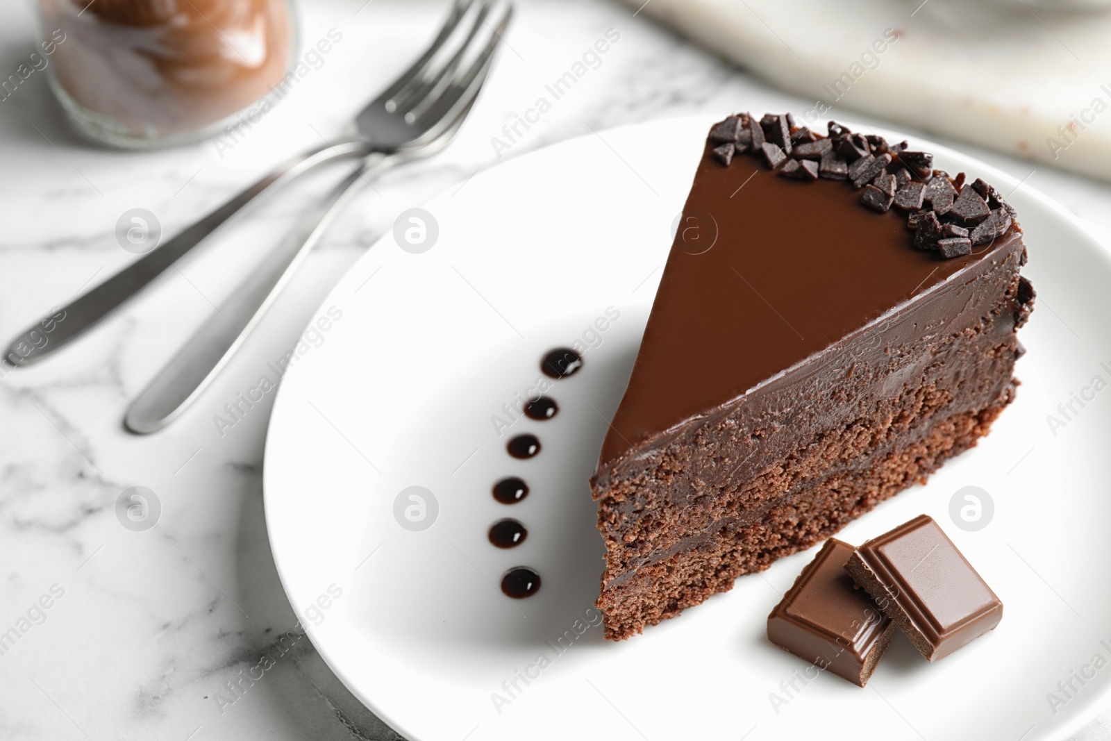 Photo of Delicious fresh chocolate cake served on white marble table