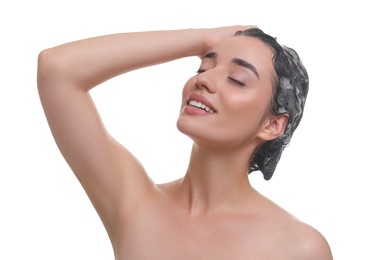 Photo of Beautiful happy woman washing hair on white background