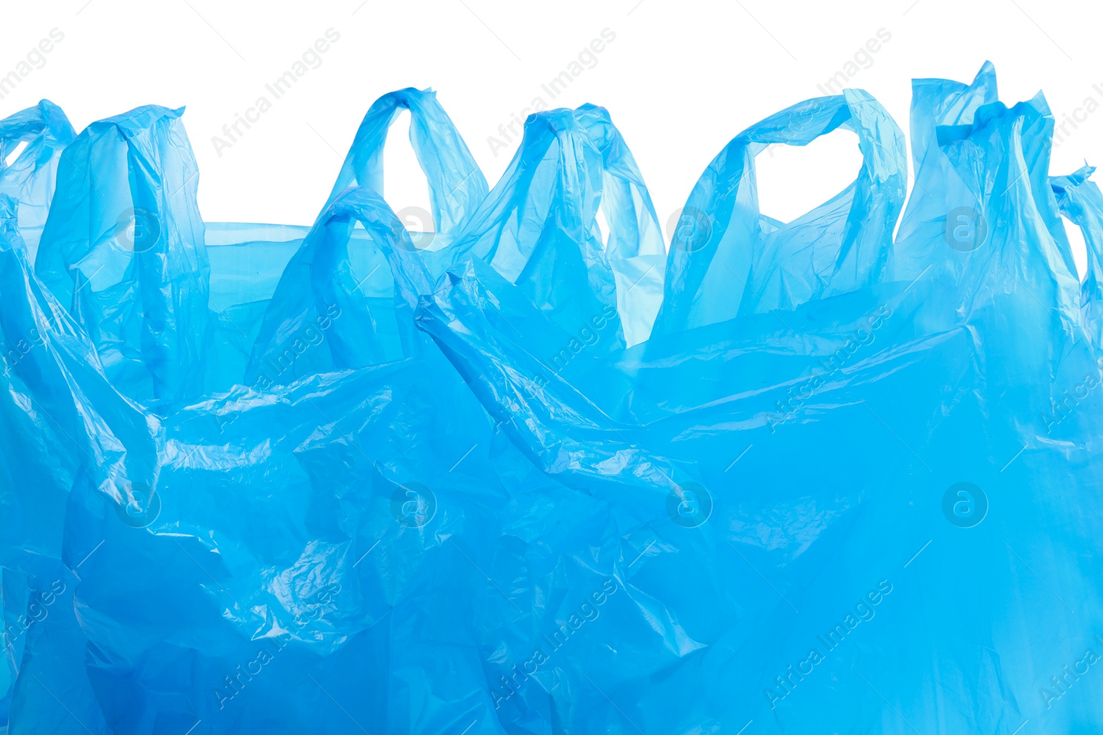 Photo of Many light blue plastic bags isolated on white