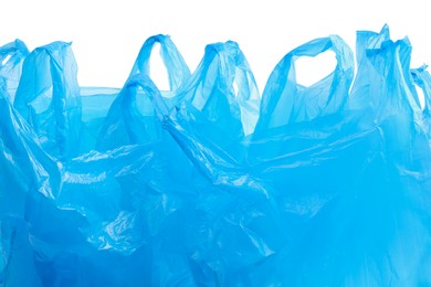 Photo of Many light blue plastic bags isolated on white