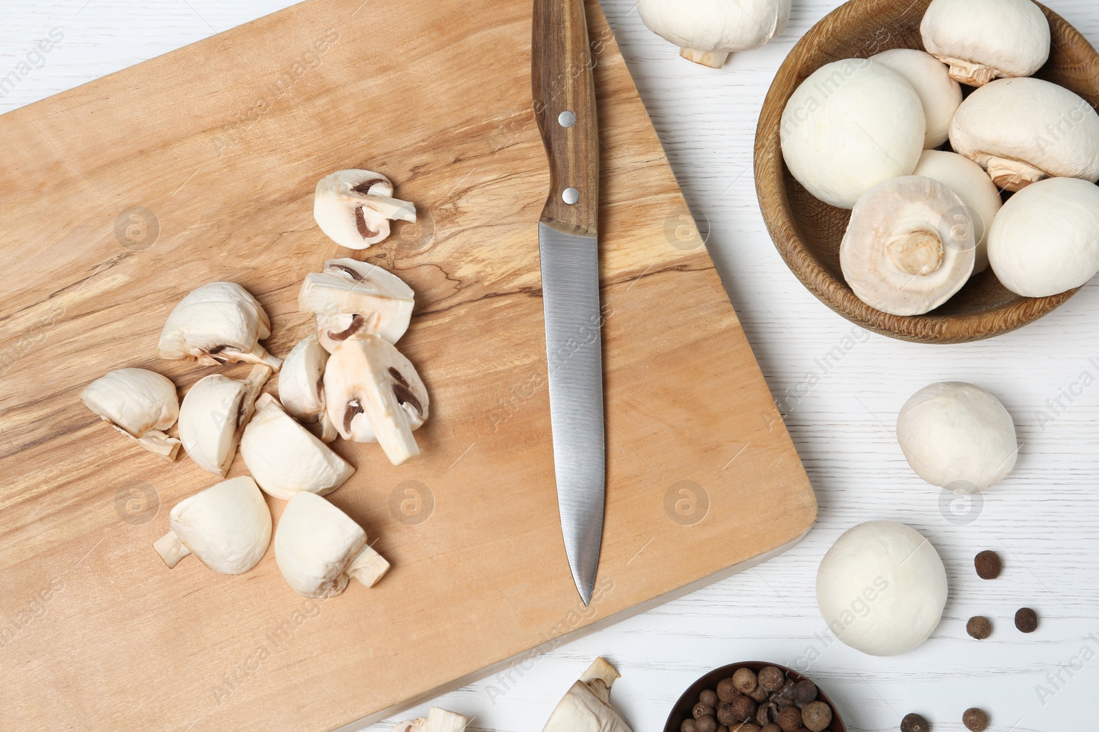 Photo of Flat lay composition with fresh champignon mushrooms on wooden table