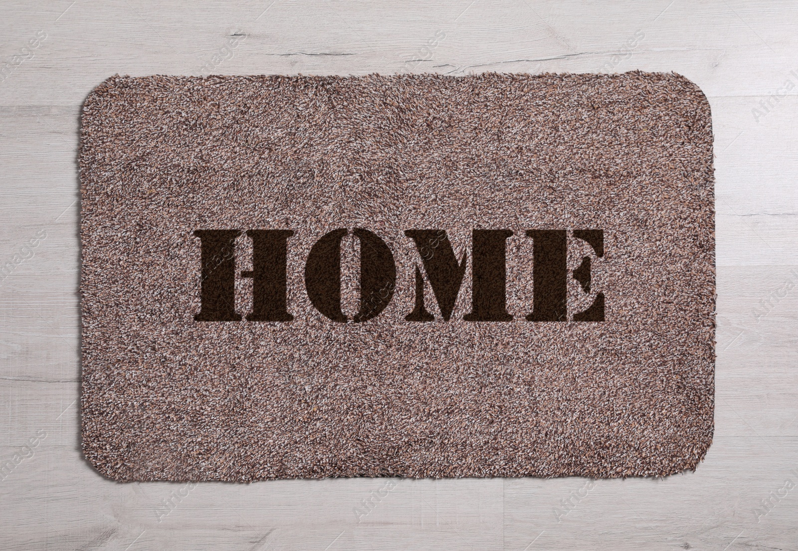 Image of Door mat with word Home on floor, top view