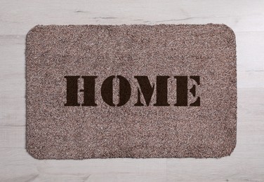 Image of Door mat with word Home on floor, top view