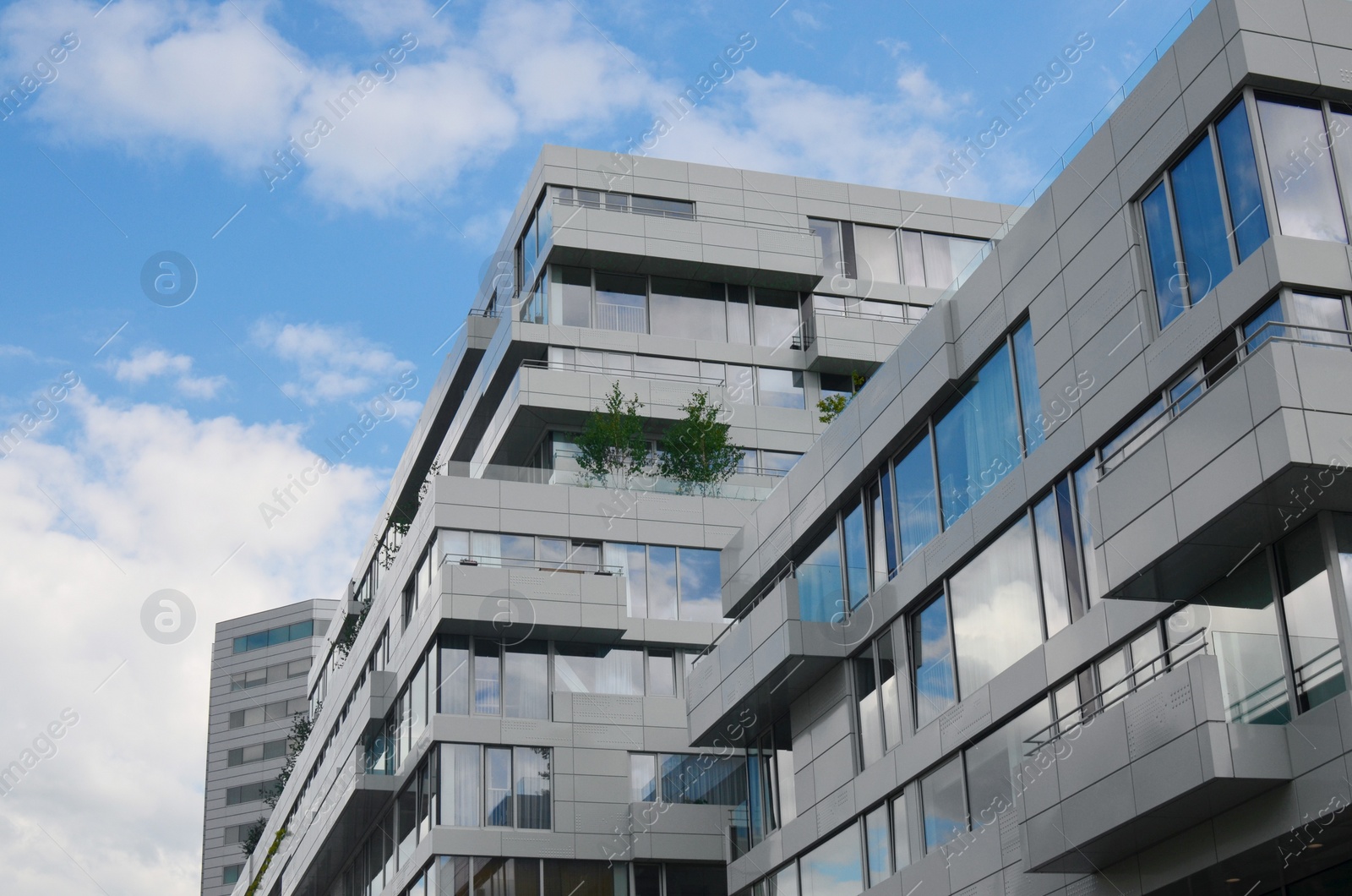 Photo of Beautiful modern building in city against blue sky