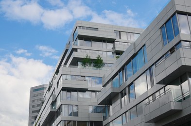 Beautiful modern building in city against blue sky