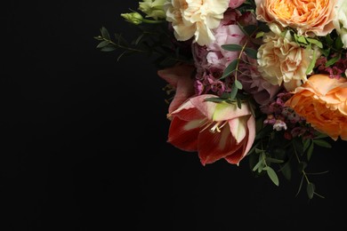 Beautiful fresh flowers on dark background, space for text