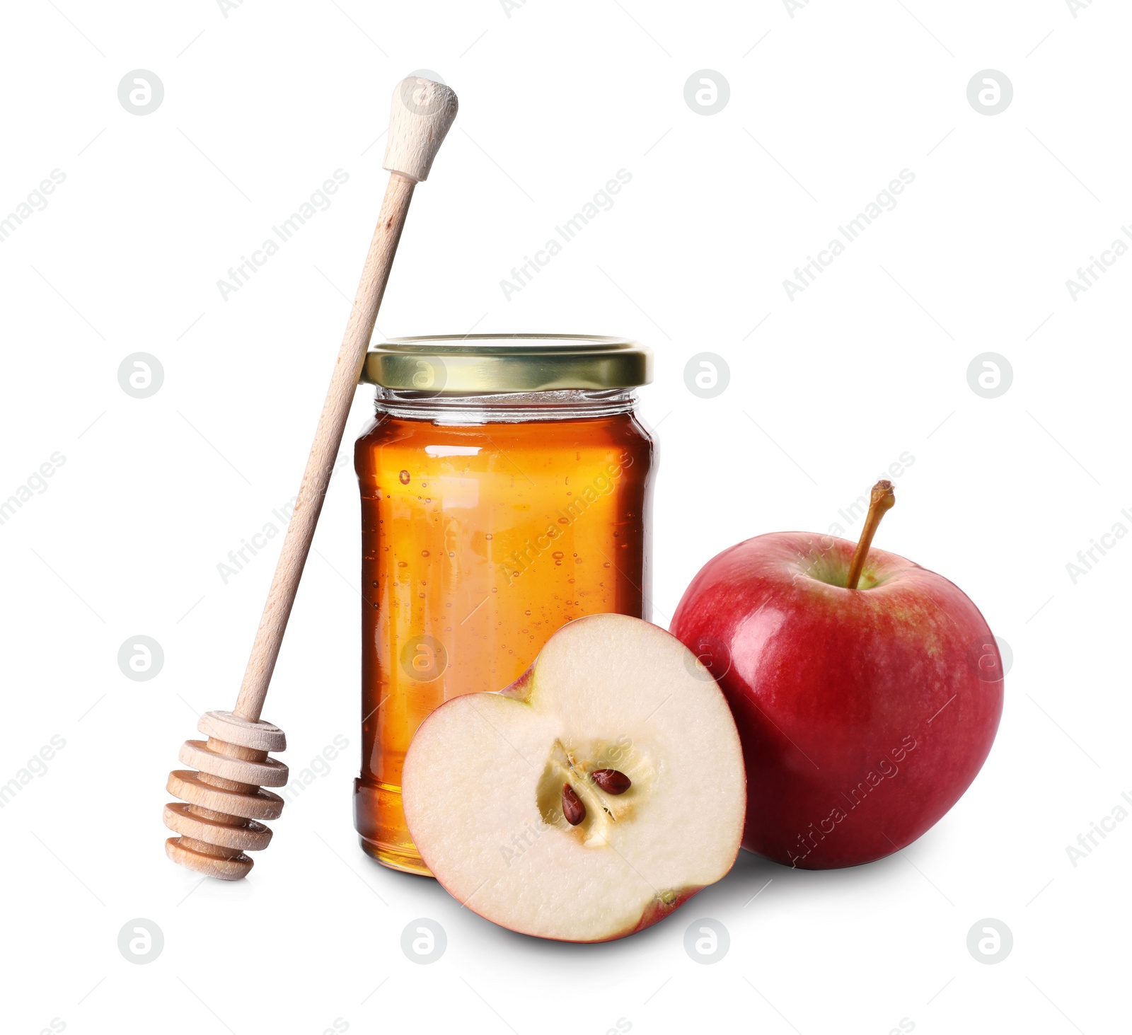 Image of Honey in glass jar, apples and dipper isolated on white