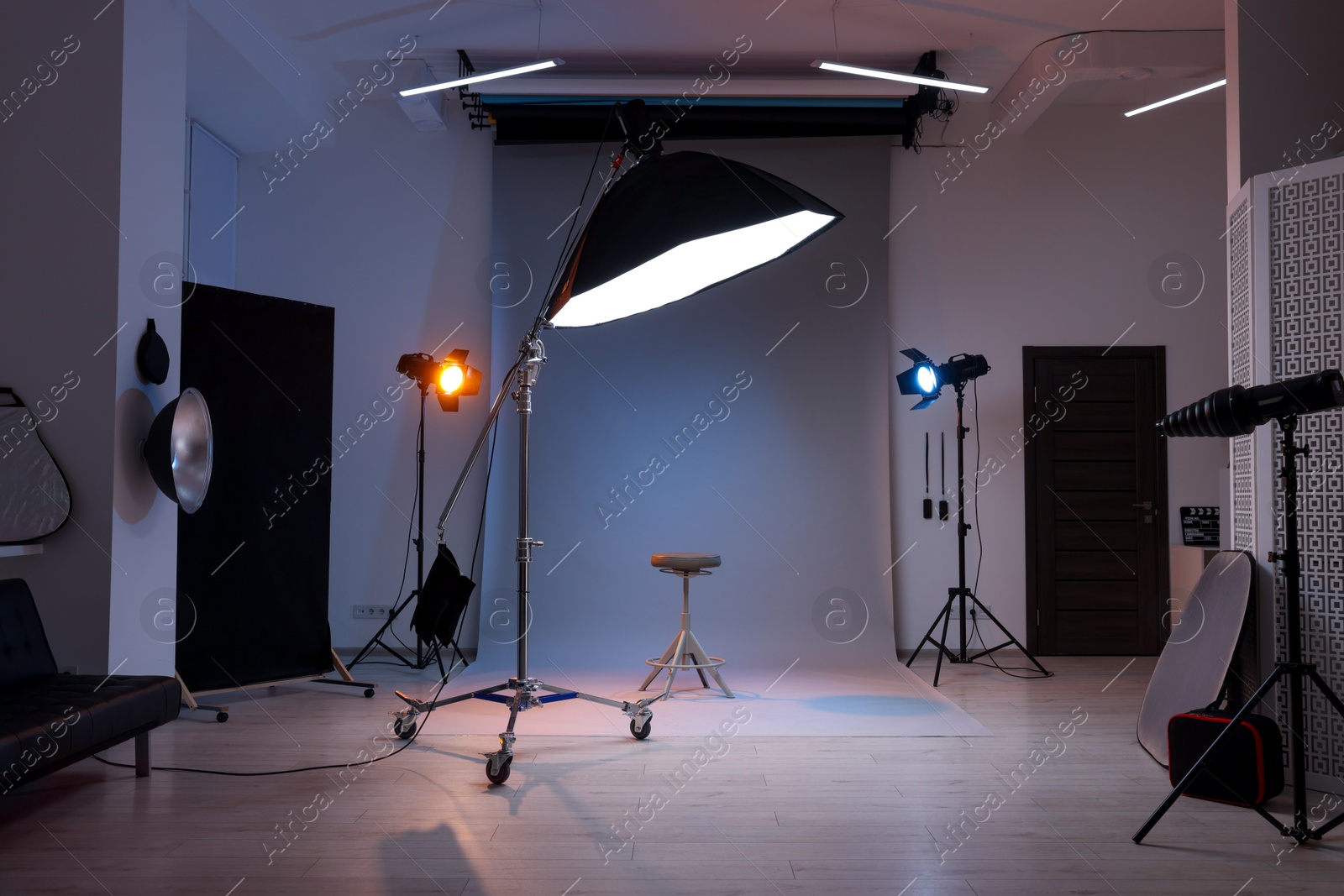 Photo of Casting call. Chair and different equipment in modern studio