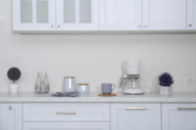 Photo of Blurred view of modern stylish kitchen interior