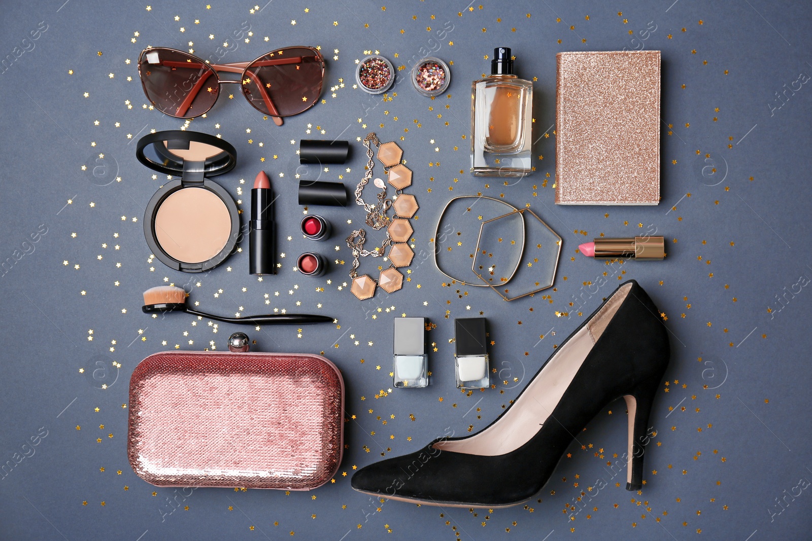 Photo of Flat lay composition with cosmetics and stylish accessories on grey background