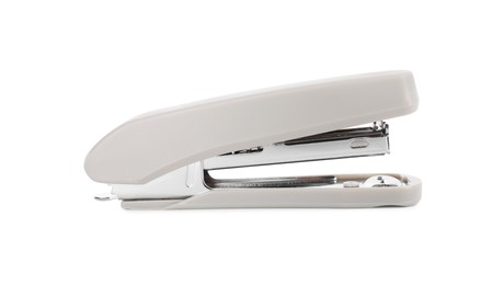 One new beige stapler isolated on white