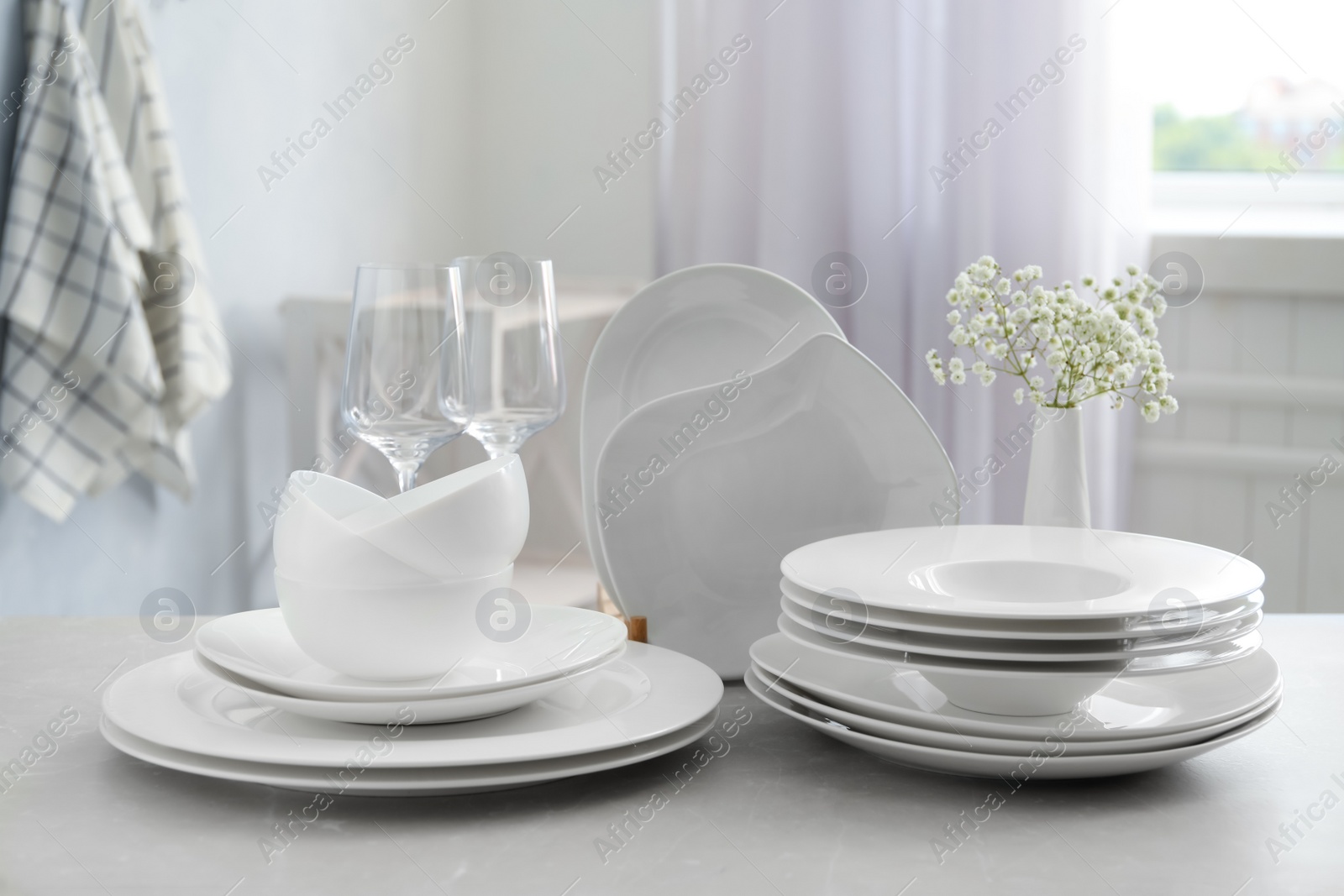 Photo of Composition with clean dishes on light grey marble table