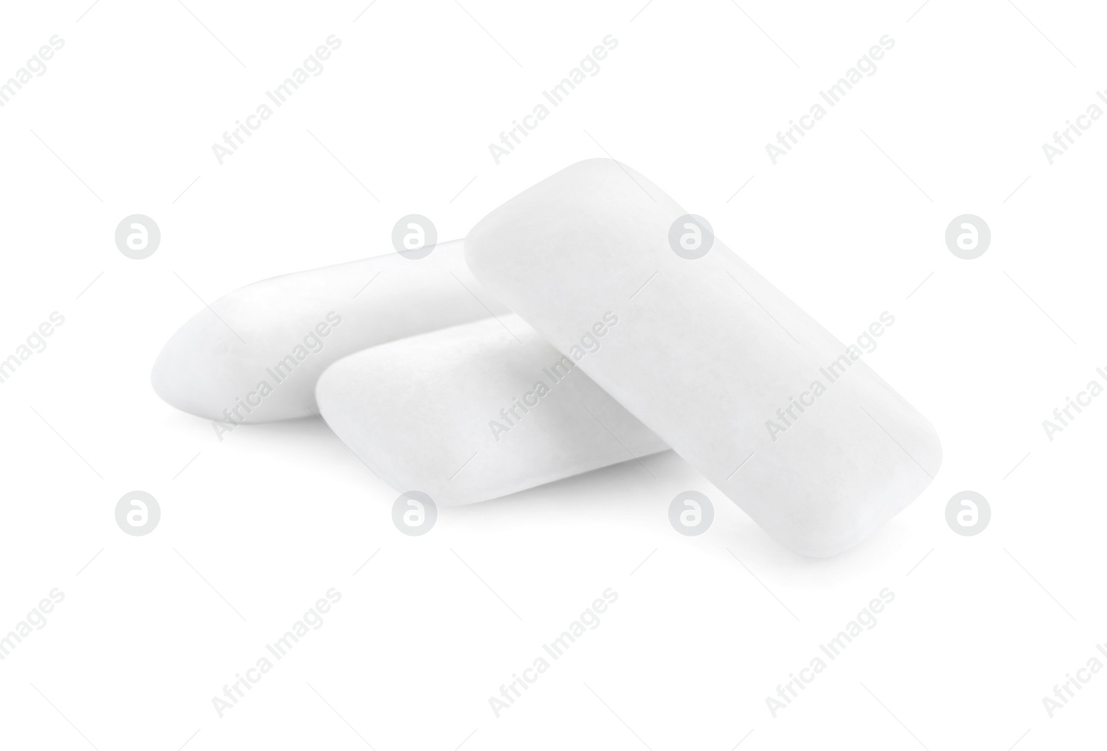 Photo of Three chewing gum pieces on white background