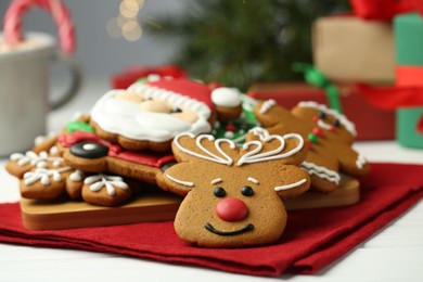 Photo of Tasty homemade Christmas cookies on white wooden table, closeup