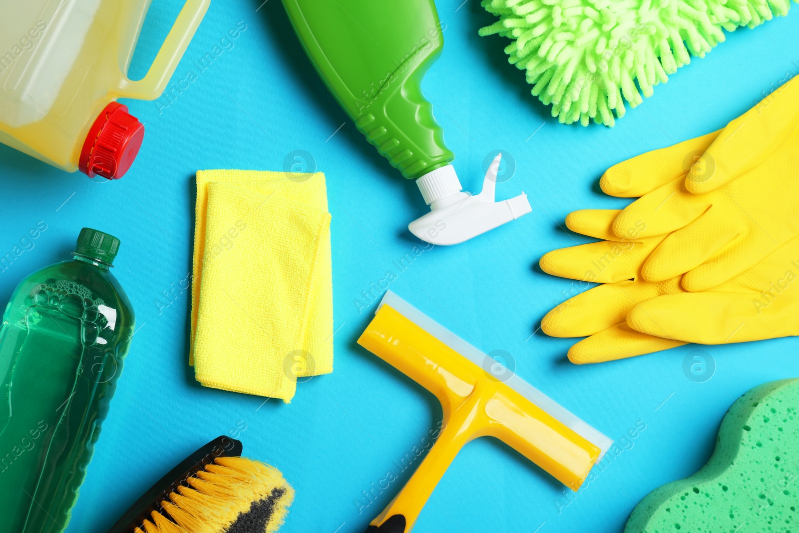 Photo of Flat lay composition with different car wash products on light blue background
