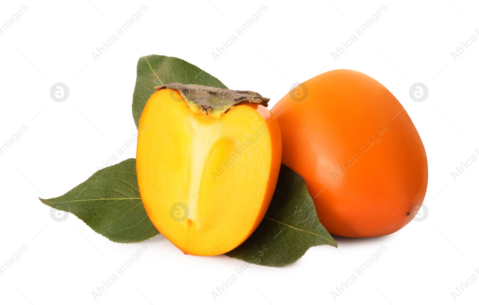 Photo of Whole and cut delicious ripe juicy persimmons on white background