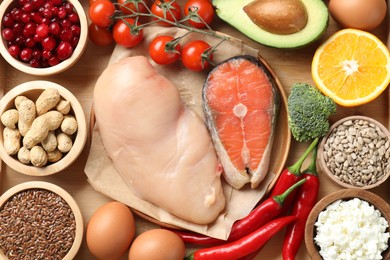 Photo of Many different healthy food on wooden table, flat lay