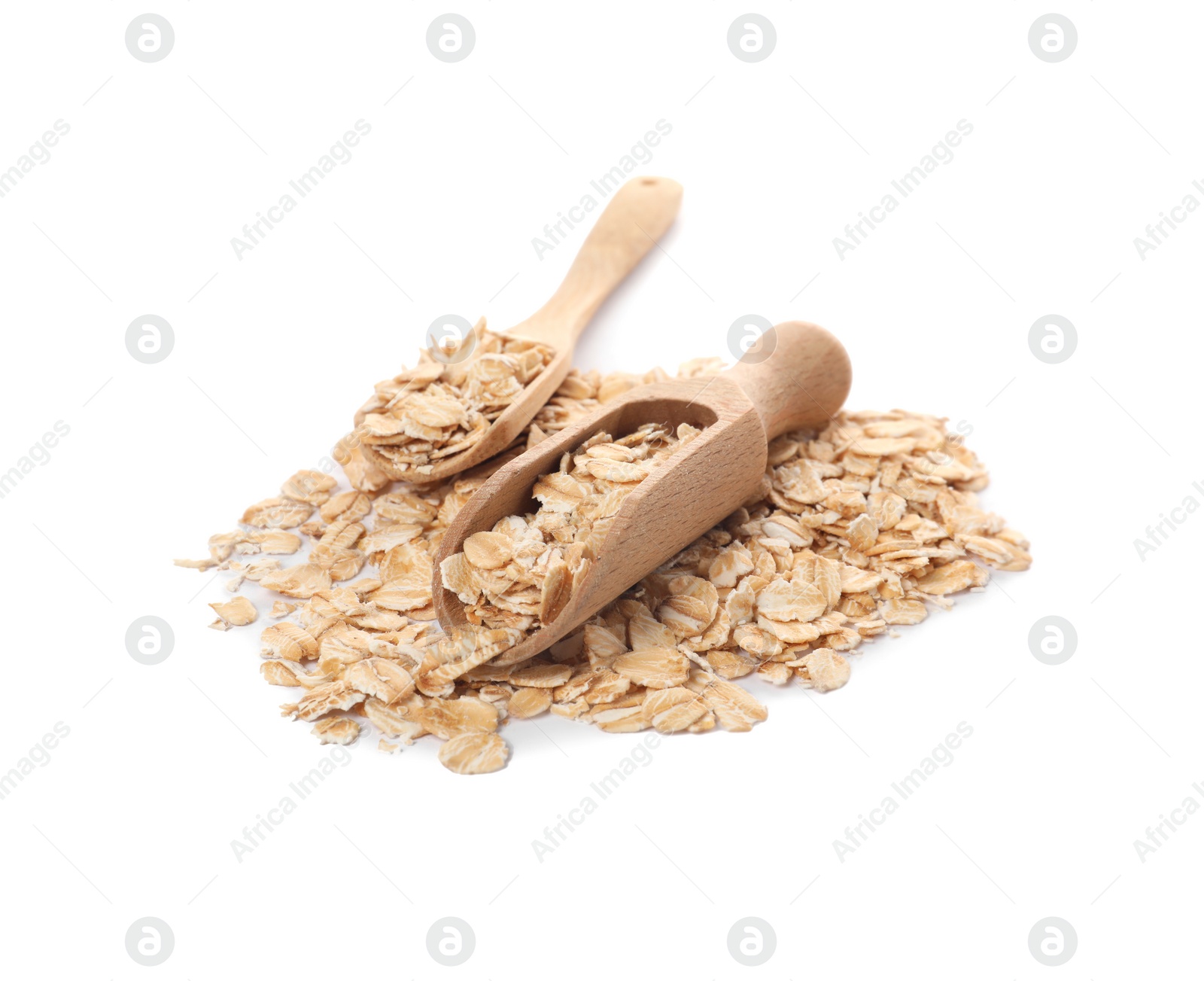 Photo of Spoon and scoop with oatmeal isolated on white