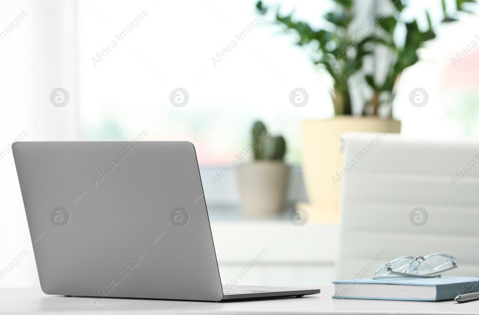 Photo of Laptop on desk in home office. Comfortable workplace