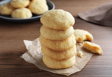 Stack of tasty sugar cookies on wooden table, closeup