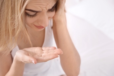 Photo of Young woman with eyelash loss problem indoors