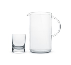 Empty glass and jug isolated on white