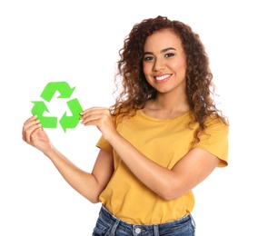 Young African-American woman with recycling symbol on white background