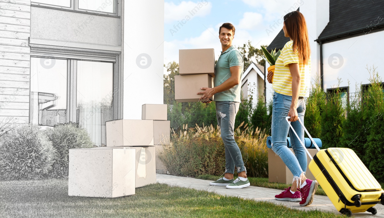 Image of Happy couple with moving boxes and household stuff near their new house